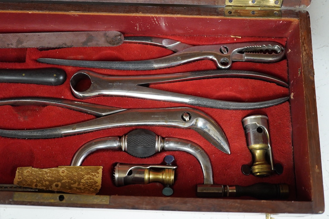 A 19th century surgeon’s set signed Mon. Charriere, Collin & Cie., Paris, in a fitted mahogany case, comprising of steel surgeons instruments; knives, scalpels, scoops, tourniquet, saws, rasps, some instruments stamped w